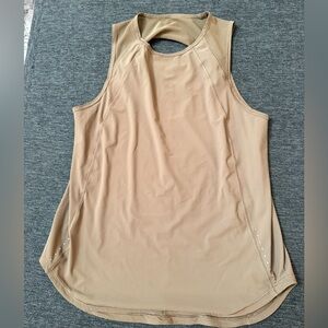 Lululemon light brown top light weight and cute cut out 17.5 pit to pit 26 in
